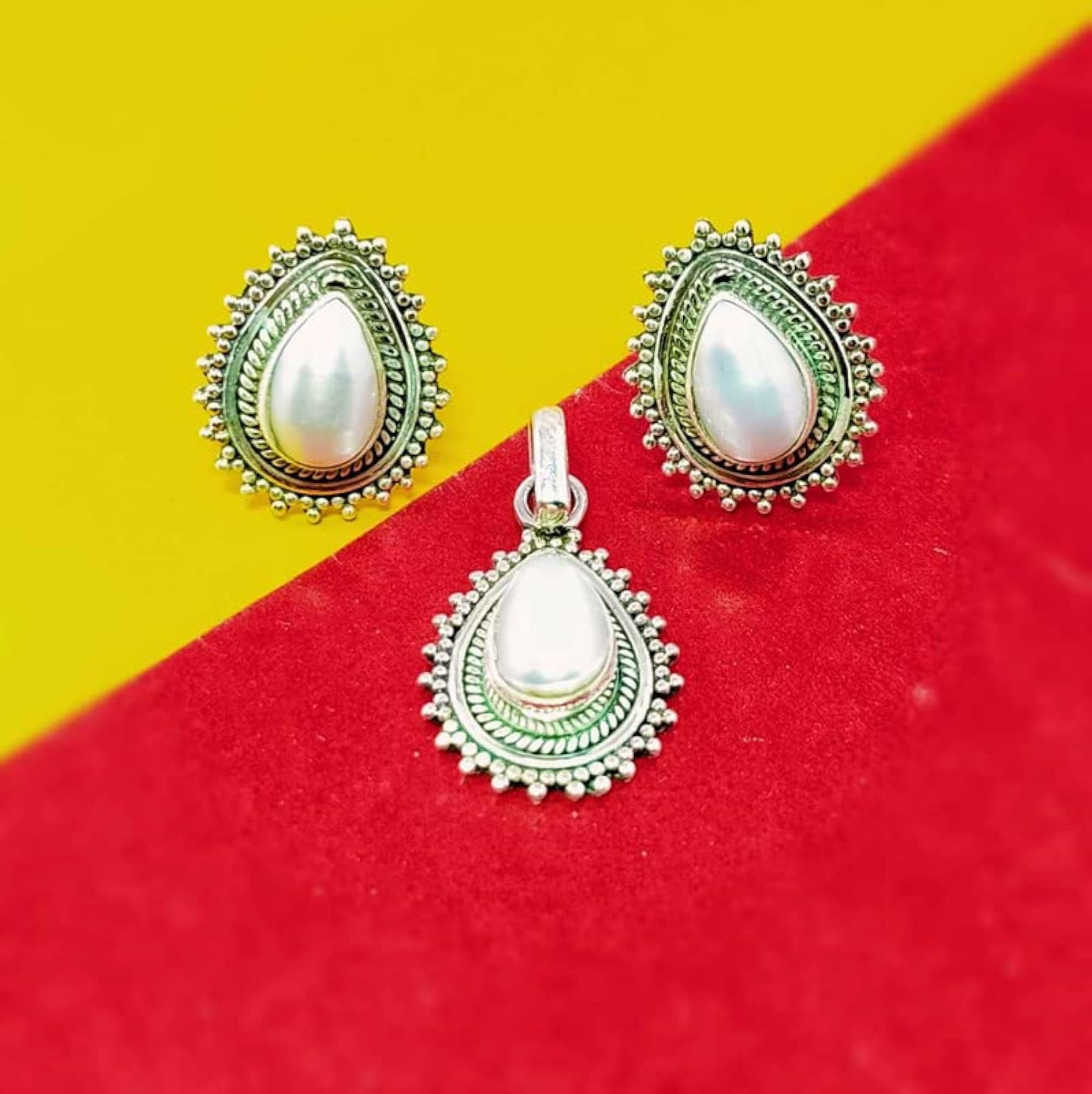 Paan Shape Rawa Work Pendant Set with Ruby, Emerald, Onyx, Pearl, Silver